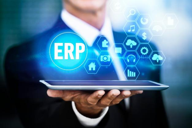 A man holding a holographic logo of ERP