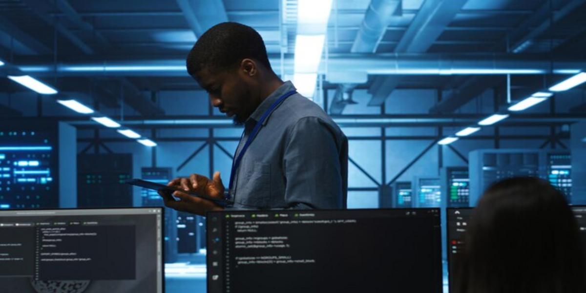 A managed IT services provider working on a tablet in a data center