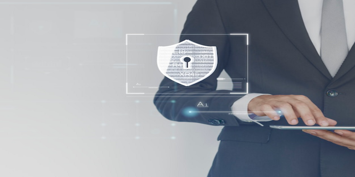 Business professional holding a digital tablet with a virtual security shield icon.