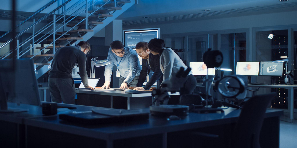 Group of professionals collaborating on IT strategy planning for business growth
