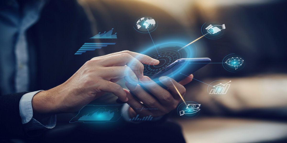 Business professional analyzing financial data using augmented reality and digital tools.