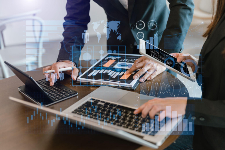 Business professionals analyzing financial performance metrics reflecting cost savings and improved accuracy from AP automation