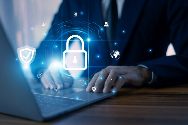 Business professional implementing cybersecurity resilience strategy on laptop with digital security lock interface