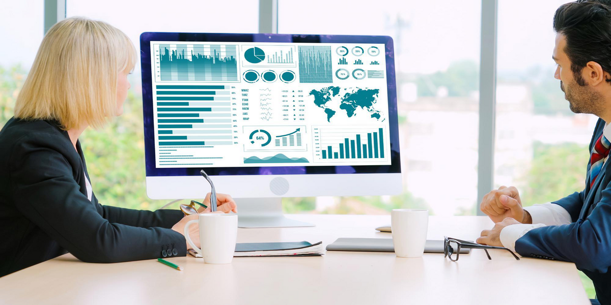 Business professionals reviewing Sage 300 automation dashboards and ERP reporting data to improve financial visibility and operational efficiency