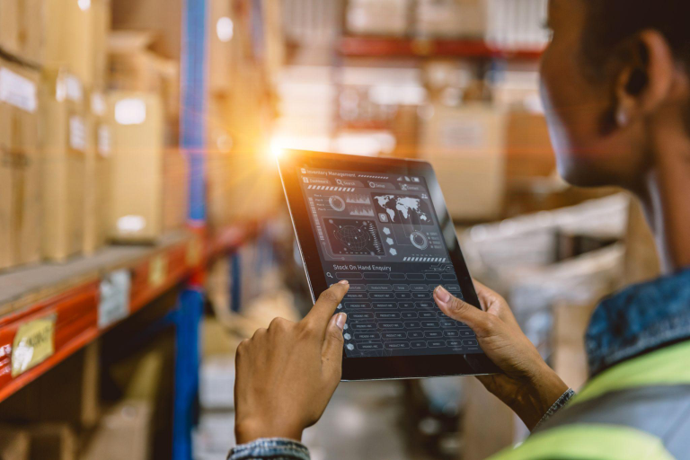 An employee analyzing ERP dashboard to manage inventory