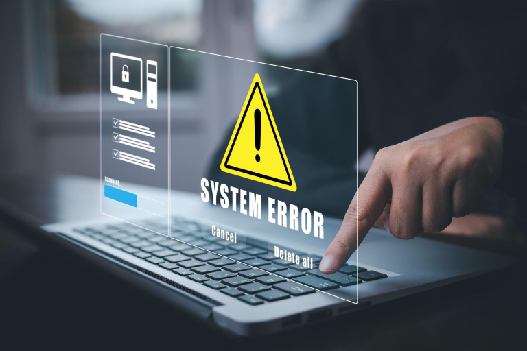 System error notification on a laptop representing reactive troubleshooting and unmanaged IT environments