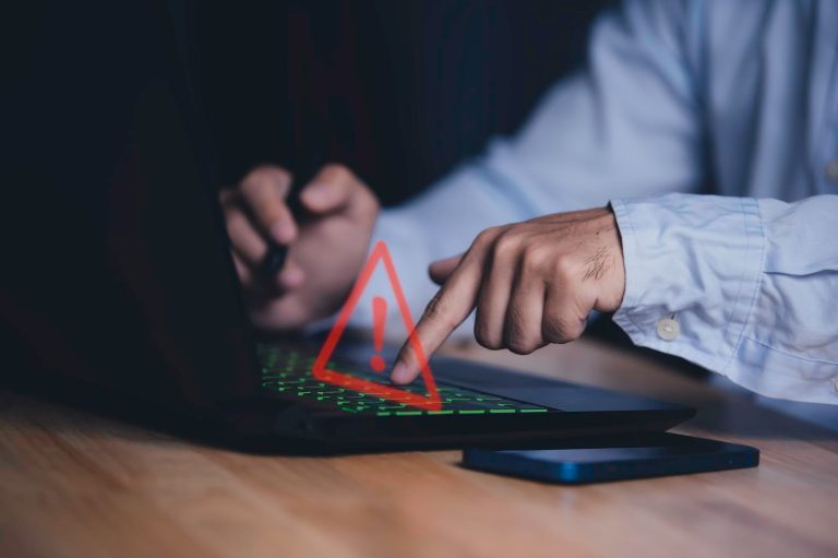 Business employee accessing sensitive company systems, illustrating insider risk and unauthorized access concerns