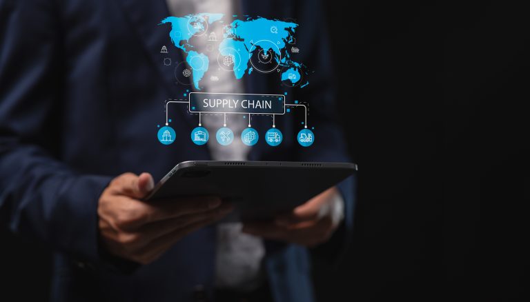 Manufacturing executive analyzing supply chain visibility and inventory management through digital ERP reporting