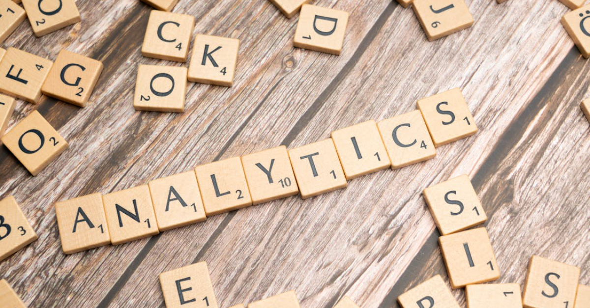 The word analytics spelled out in Scrabble tiles