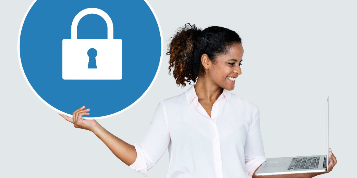 Woman holding a security icon and laptop