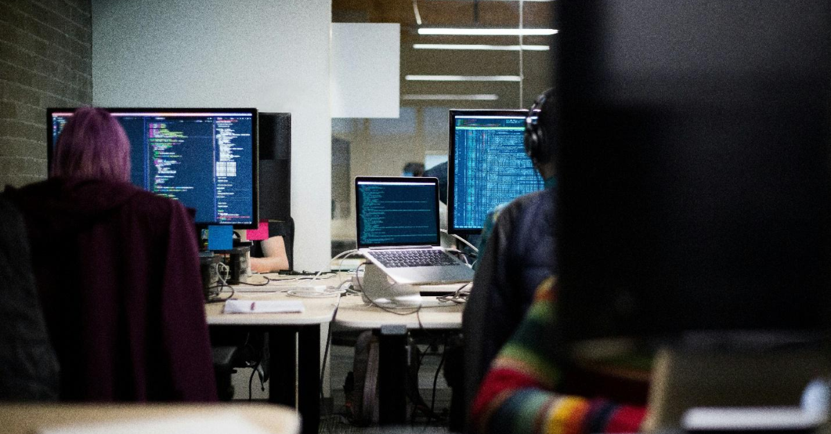 people-behind-chairs-monitor-code-cyber-security-services People behind chairs with monitors displaying code, emphasizing the importance of cyber security services for Sage Intacct, Sage 300 ERP, or QuickBooks.